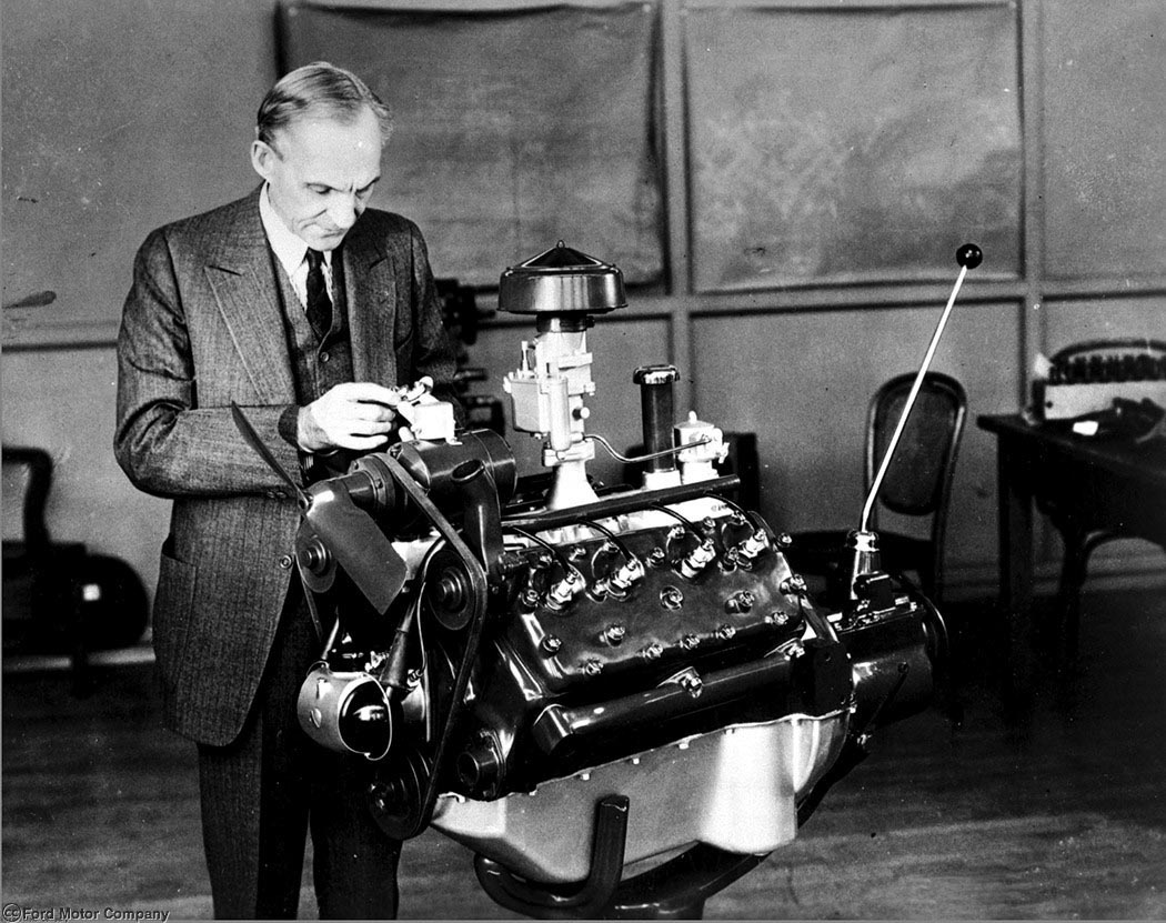 1932: Henry Ford & their new V-8 engine.