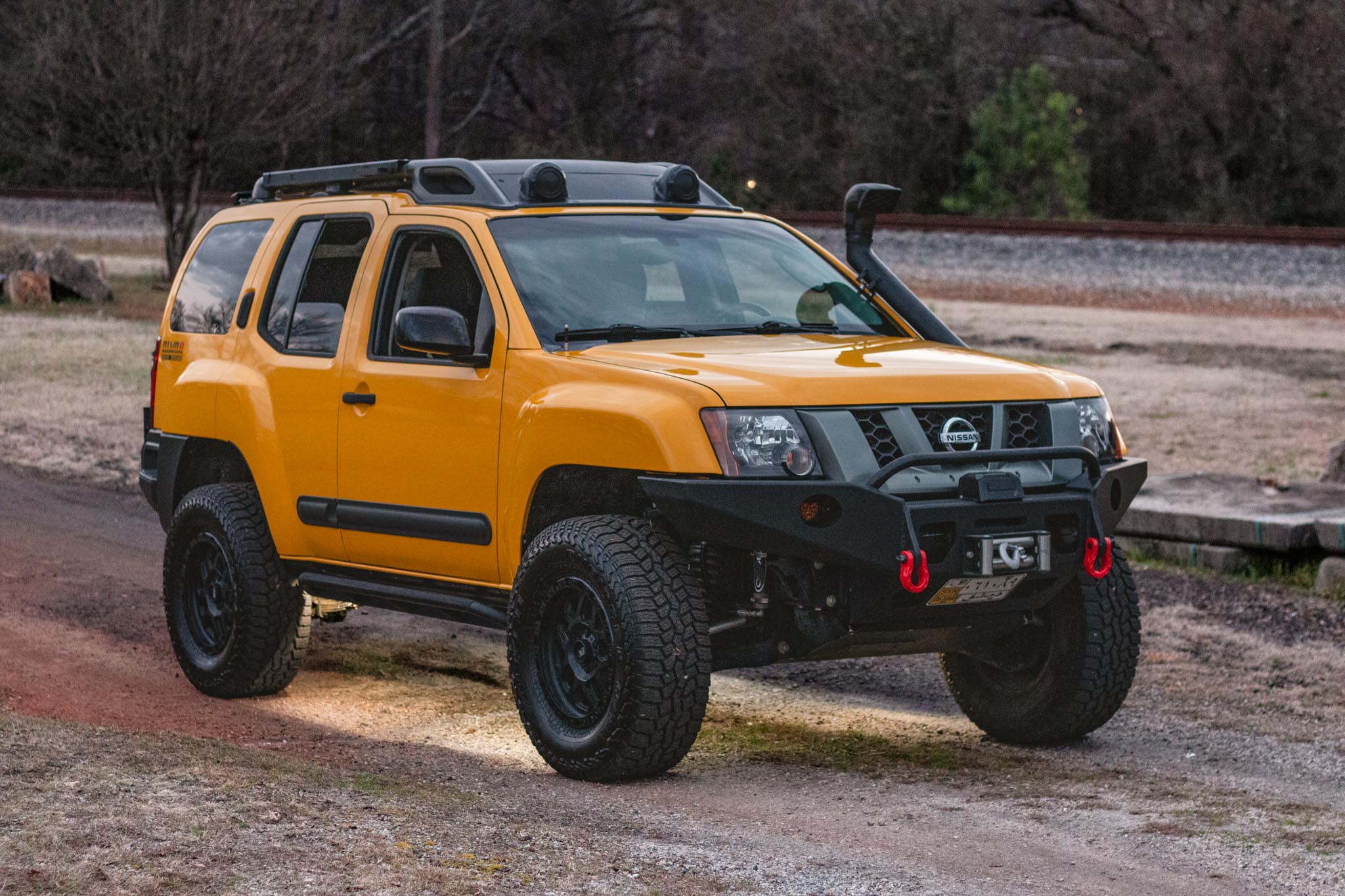 Nissan Xterra Yellow lifted Titan swap suspension