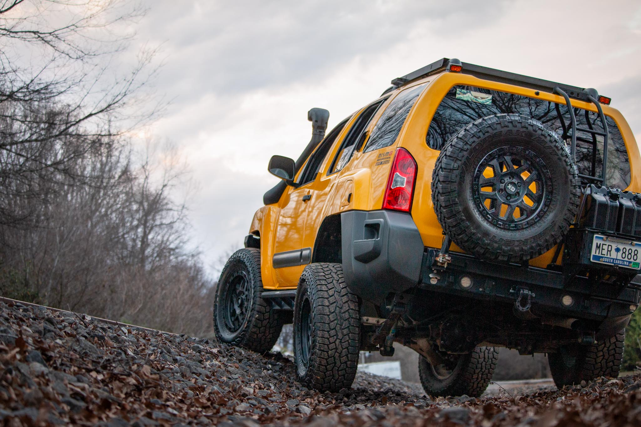 Nissan Xterra Yellow lifted Titan swap suspension