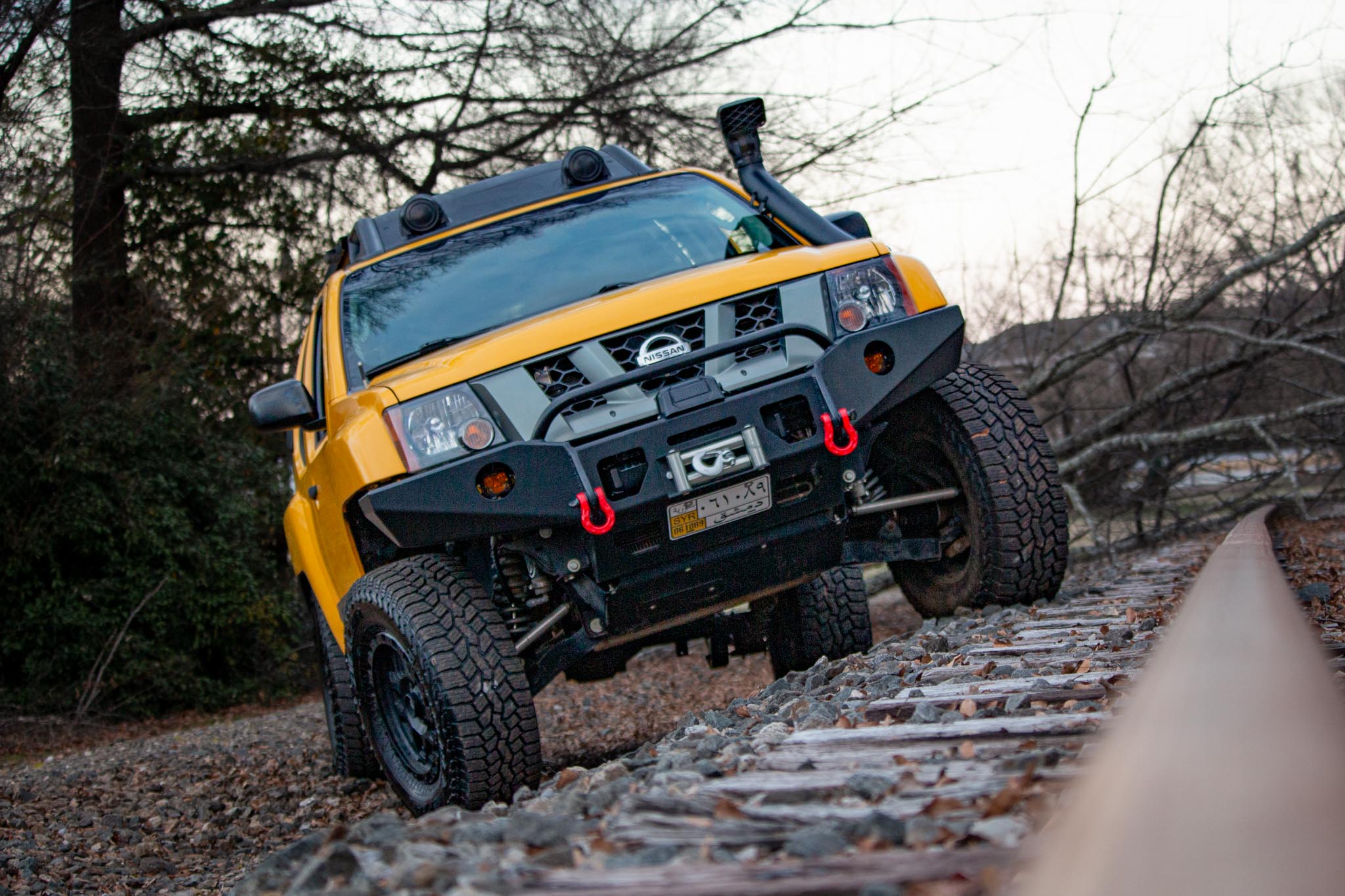 Nissan Xterra Yellow lifted Titan swap suspension