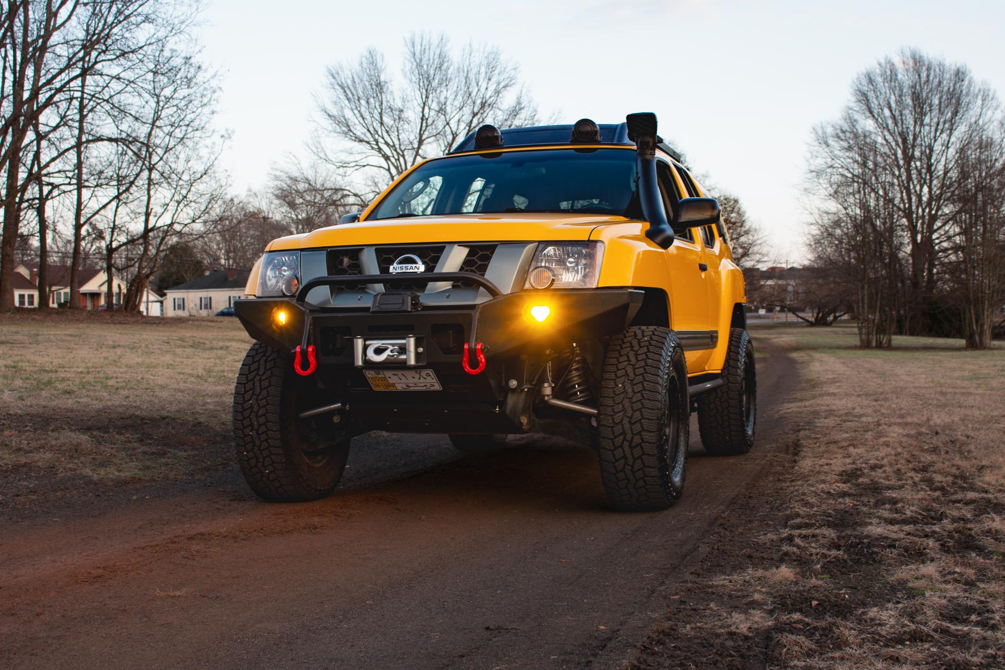 Nissan Xterra Yellow lifted Titan swap suspension