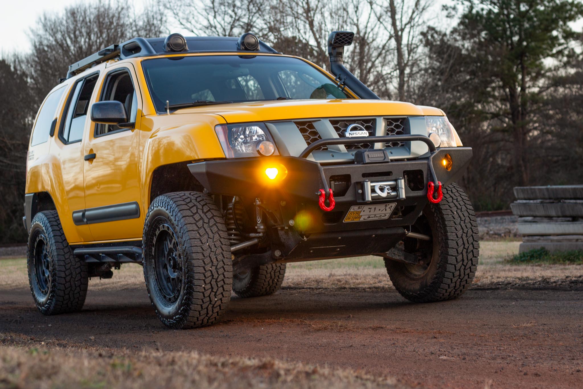 Nissan Xterra Yellow lifted Titan swap suspension