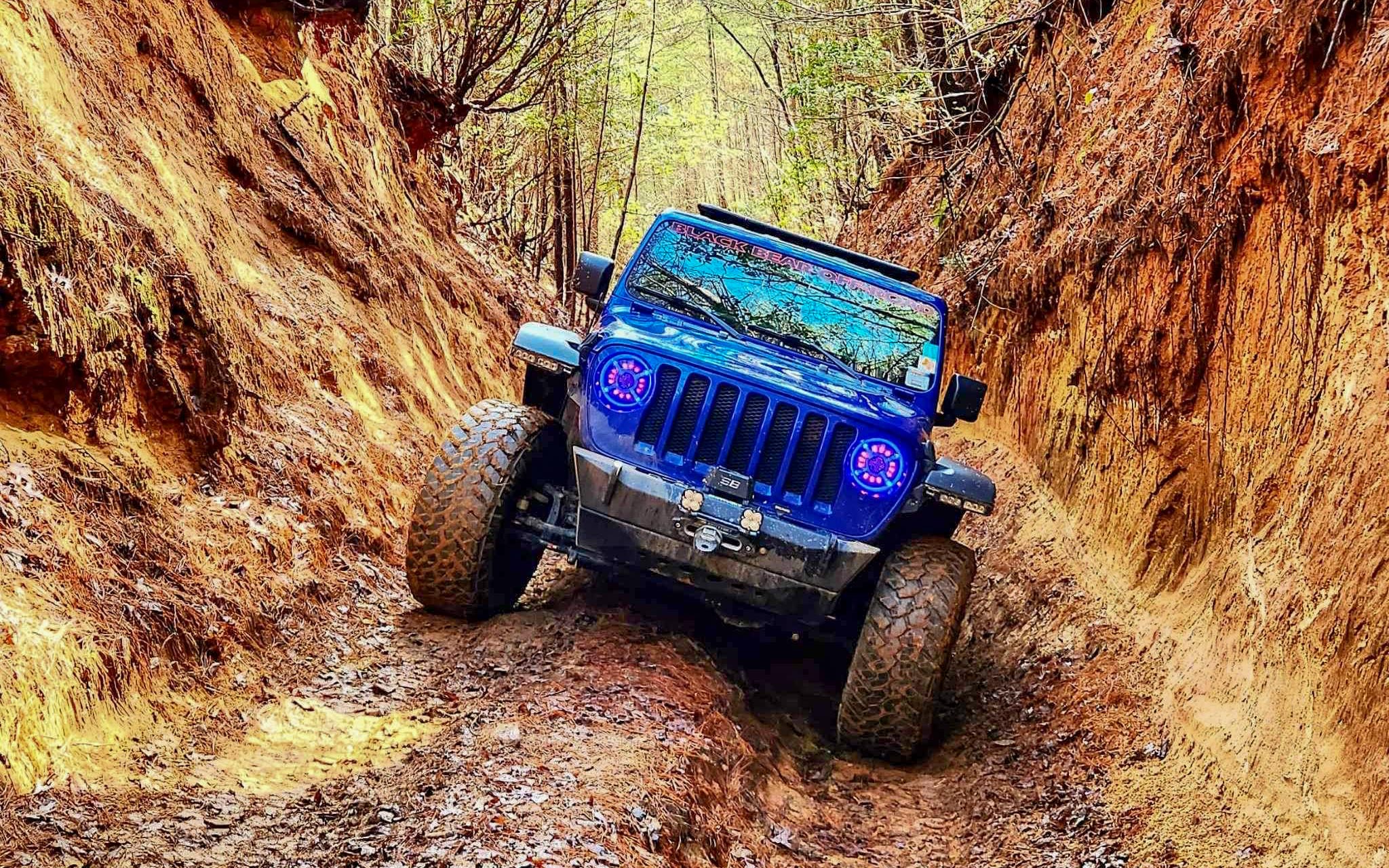 blueJeep on muddy trail