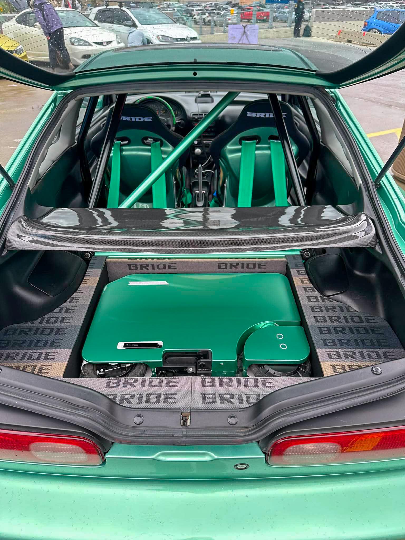 Motocompacto incorporated into trunk storage in Honda Acura INtregra